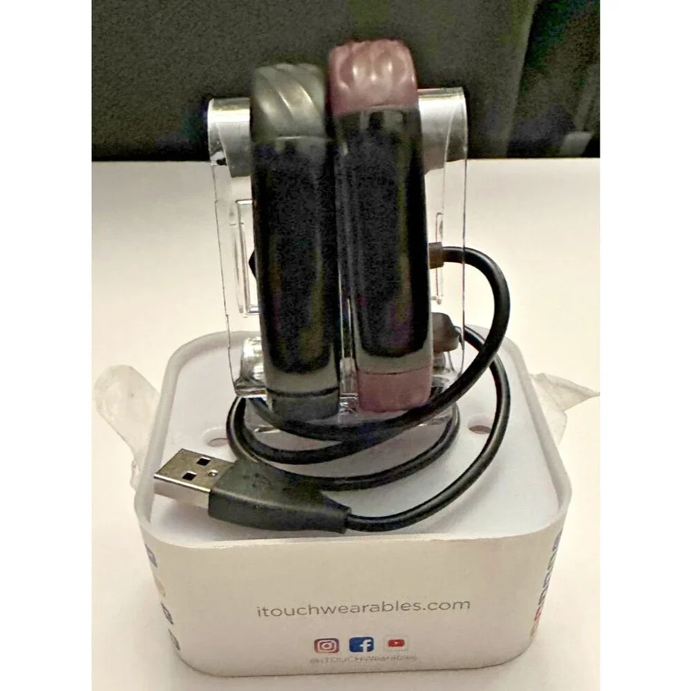 Two itouch slim fitness trackers and 2 chargers (not tested)
